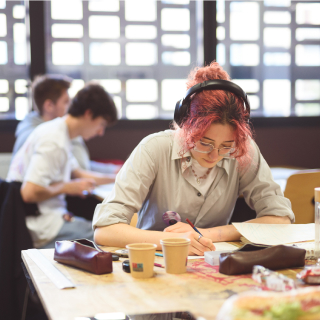 ESMA students collaborating in a creative workspace, showcasing the collaborative environment of the school’s multidisciplinary art and design programs
